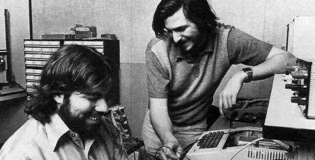 In the early 1970s, Steve Jobs and Steve Wozniak at a workbench, repairing or debugging a computer prototype together.